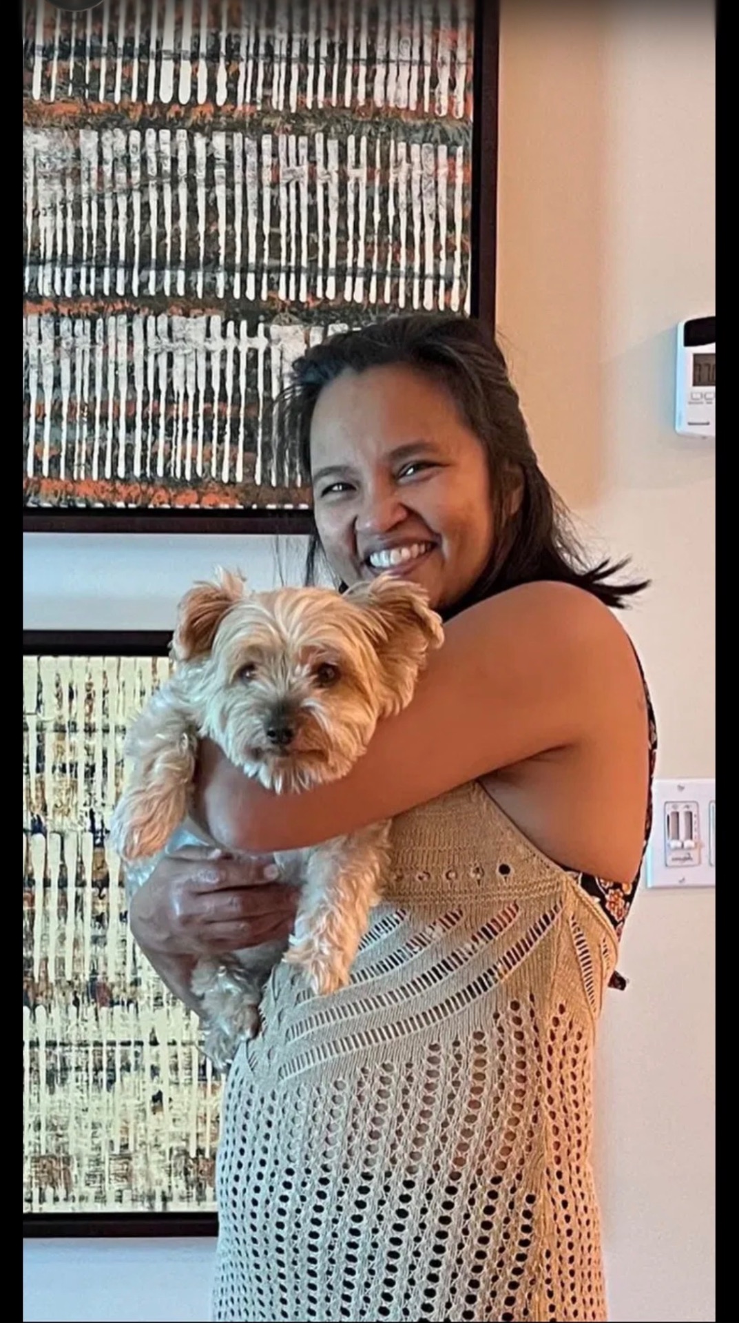 Holding a beloved white Yorkie